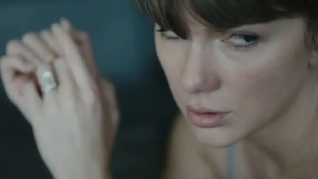 Taylor Swift Ditches Her Signature Glam and Red Lip for Surprising Makeunder in ‘Patient Zero’ Music Video Taylor Swift Ditches Her Signature Glam and Red Lip for Surprising Makeunder in ‘Patient Zero’ Music Video